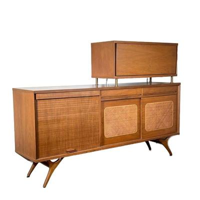 Mid-century Bar Cabinet | The lower section with a tambour door next to double cane front sliding doors, with an illuminated half upper...