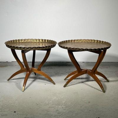 (2pc) Brass Tray Top Tables | Two similar brass trays with scalloped edges and engraved decoration on folding mid century wood stands...