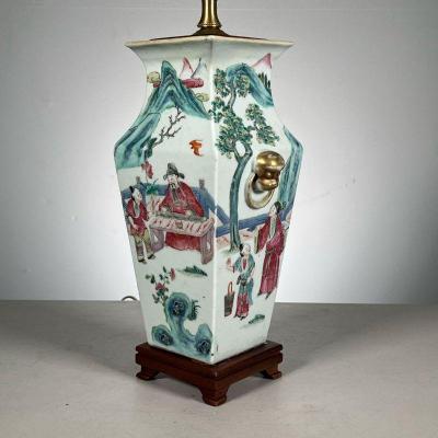 Antique Chinese Vase | Famille rose vase decorated with figures engaged in various activities amongst landscapes, mounted on a wood base...