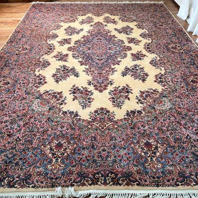 Karastan Kirman Carpet | Approx. 12 x 9 rug with central medallion on a cream field within a densely patterned border, made in USA,...