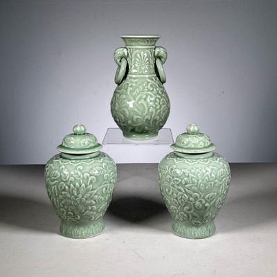 (3pc) Celadon Garniture | Chinese sculpted celadon, including a vase and two lidded jars. - h. 7.5 x dia. 4 in (vase) 