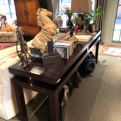 Sofa table with CDs, DVDs, VHS tapes