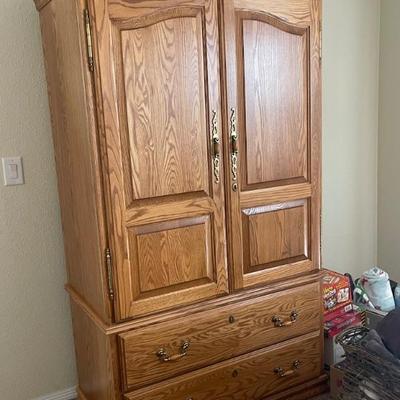Armoire with locking features for jewelry can hang clothing or put a TV