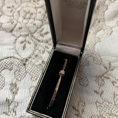 .27 Diamond incased in 14 karat gold 