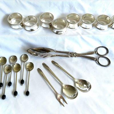 Assorted Metal napkin rings, utensils
