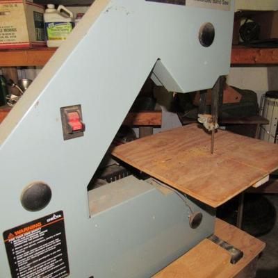 This band saw is attached to a work table with another band saw and sander.  It will be sold as is.  All three items work