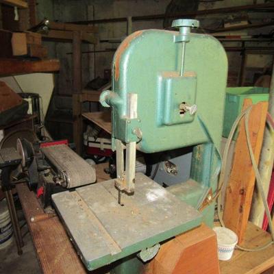 This band saw is attached to a work table with another band saw and sander.  It will be sold as is.  All three items work.