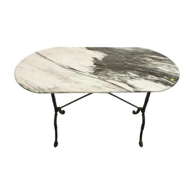 Antique French Marble Top Pastry Table, early 20th century, having an oval molded edge white marble top resting on a cast iron trestle...