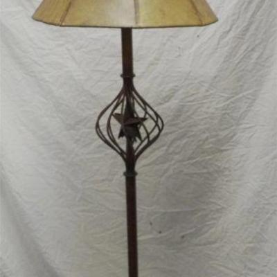 Southwestern style forged iron floor lamp featuring a lone star final and hide shade originally purchased in Sedona, AZ. This piece...