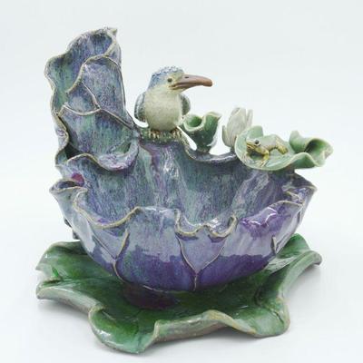 Handcrafted majolica pottery bowl featuring a seated kingfisher bird and a green frog on a leaf pad atop a scalloped deep bowl with a...