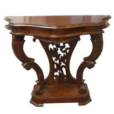 Carved mahogany console table that would be perfect for an entry or hallway. This piece has a carved and pieced fora and scroll back and...