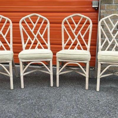Set of 4 Matching Vintage Chinese Chippendale Rattan Dining Chairs. Chinoiserie style fretwork, splayed rear legs and cushioned seats....