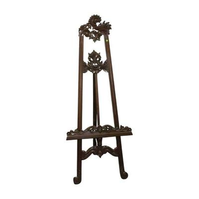 Beautiful carved Mahogany fine art easel, adjustable with extension chain. Dimensions: 6' tall.