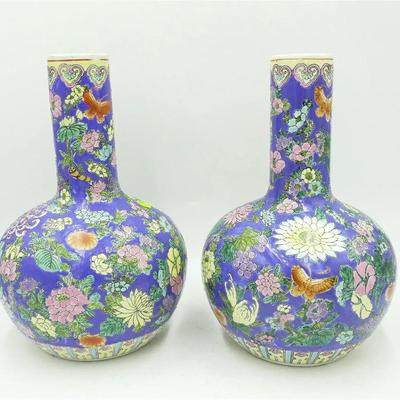 Pair of Vintage Large Hand Painted Macau Bottle Vases. Blue ground with florals and butterflies. Each 8"x8"x13.5". 