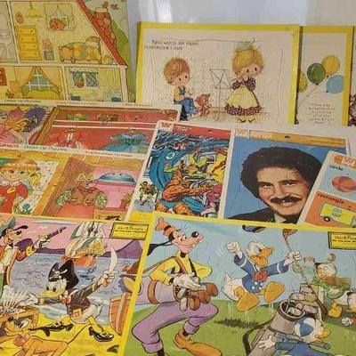 (11) Puzzles
Two Walt Disney Inlaid Puzzles. Whitman: Fantastic Four and Welcome Back Kotter Frame-Tray Puzzles. Three Susanna The...