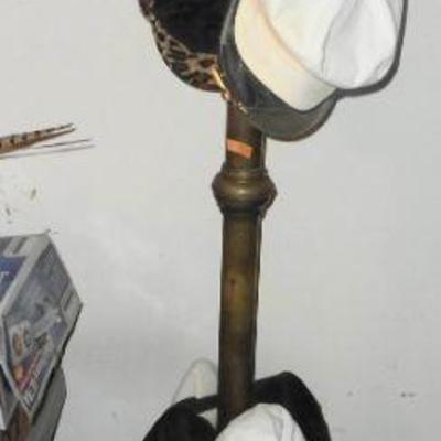 Brass hat=coat rack, lots of hats