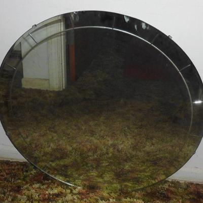 Round hanging mirror.