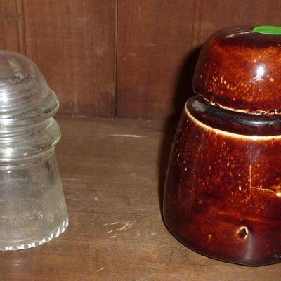 Clear glass insulator and pottery insulator