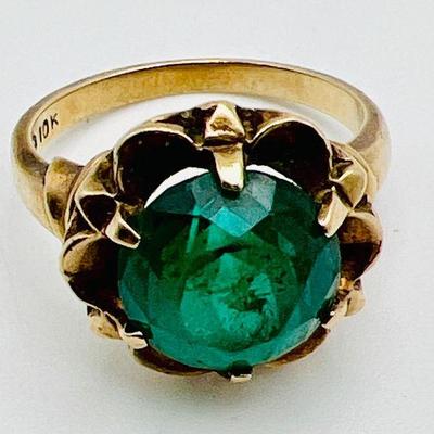 10K Gold Ring With Vivid Green Stone
Stamped 10k as shown. Approximate size six, see photo on ring sizer. 
