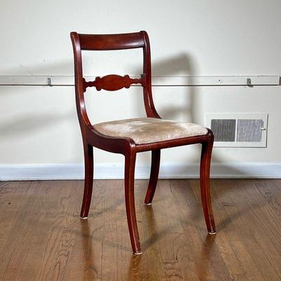 LADDER-BACK MAHOGANY CHAIR | Carved ladder back mahogany chair with champagne cushion. 
