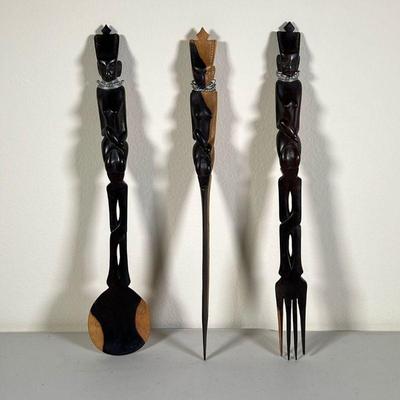 AFRICAN CARVED SERVING UTENSILS | Knife, fork, and spoon serving utensils with hand carved handles depicting African figures with bent...