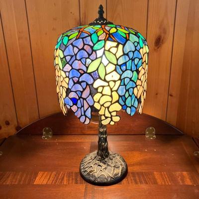 STAINED GLASS LAMP W/BLUE GREEN SHADE | Ornate tree design on bronze color base. Helmet design shade with flowers flowing down. Lamp of...