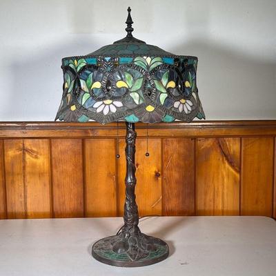 STAINED GLASS LAMP W/GREEN SHADE | Elaborate base with leaves and a vine. Green stained glass on base as well. Shade has an all-green top...