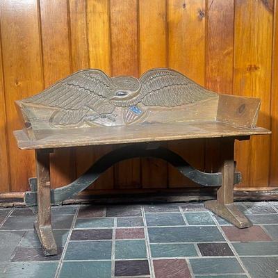 EAGLE CARVED BENCH | Pine 20th C Bench with a Carved Eagle and the American Shield. Shield, arrows and eye are painted. Bench has a...