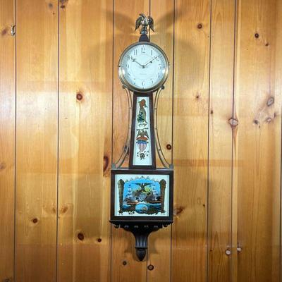 WALTHAM BANJO CLOCK | Mahogany Waltham Banjo Clock with reverse painting of ships in battle. Throat panel has Eagle and Shield. Has...
