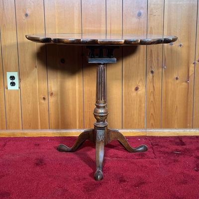 BIRDCAGE TILT TOP TEA TABLE | Mahogany Tilt Top Tea Table with birdcage structure. Top has inlaid wood at the perimeter of the scalloped...