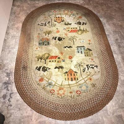 FOLK ART BRAIDED RUG | Vintage Braided Rug with a center design of Houses, Barns, Cows, Sheep, Trees and Flowers in subdued colors with a...
