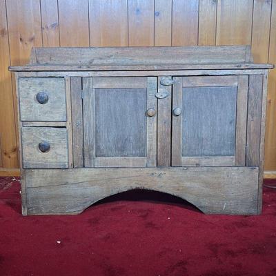 LOW COUNTRY CUPBOARD | 19th C Low Cupboard with two doors and two drawers. Has a matte finish with lots of marks and wear. Has a splash...