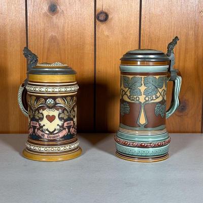 (2PC) METTLACH STEINS #1 | ncludes: (1) 2800 Castle Mark in Green and Brown with hops. (1) 1395 Castle Mark in tan with the four card...