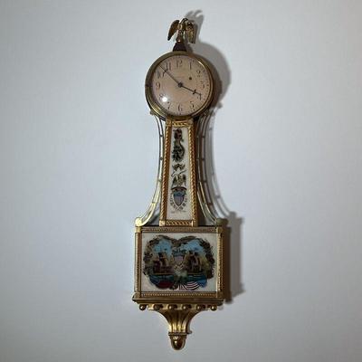 WALTHAM 1812 BANJO CLOCK | Waltham Gilded Banjo Clock with reverse painted panel of â€œLake Erie Perryâ€™s Victory Sept. 10 1813â€ with...