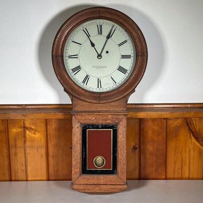 E. HOWARD WALL CLOCK | â€œE. Howard & Co. Bostonâ€. An Edward Howard Wall Clock Model 70 in an oak case. Has original pendulum, a key...