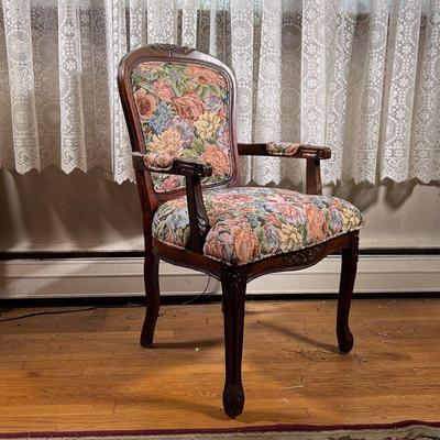 LOUIS XV BERGERE ARMCHAIR | A Louis XV style nicely carved armchair with a like new classic upholstery. - l. 23 x w. 19 x h. 39.5 in 