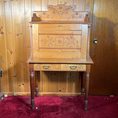 EASTLAKE DESK | 19th C Eastlake Drop Front Desk with gallery top, chip carved flowers and two drawers. Nice natural finish. - l. 36 x w....
