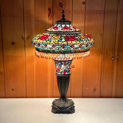STAINED GLASS LAMP W/HANGING BEADS | Ornate bronze color base with a column that has stained glass as well. Top shade has very ornate...