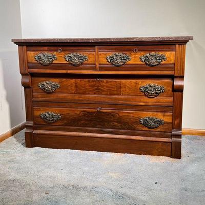VICTORIAN MARBLE TOP CHEST | A 19th C Victorian two tone chest with two drawers over four. Brown marble top with all original hardware....