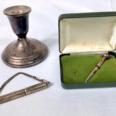 JIFI944 Solid & Weighted Sterling	41 grams weighted sterling. Â Acme silent dog whistle, vintage golf tee, & candle holder

