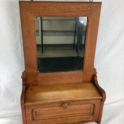 JIFI126 Antique Hanging Mirrored Cabinet	This is an antique hanging mirrored cabinet. This piece could have been used for shaving and/or...