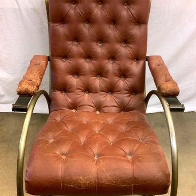 LAGO703 Mid Century Lee Woodward Leather Rocker	Unique MCM rocker. This chair is tufted brown leather. Signs of wear as seen in pictures....