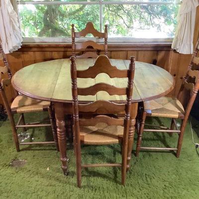 JIFI201 Antique Table & Chairs	Antique table with two folding ends. Looks as though there should be an additional leaf, however we...