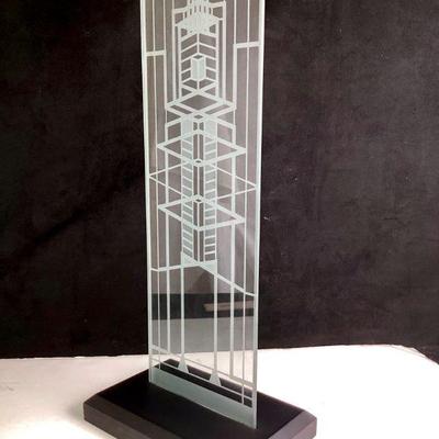 JIFI914 Frank Loyd Wright Robbie House Glass Panel	Etched glass panel mounted on black wood base, inspired by the window panels located...