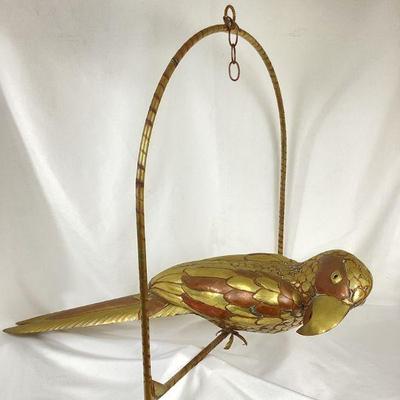 JIFI117 Brass Bustamante Parrot #1	This is a large brass Bustamante parrot hanging sculpture. It features beautifully handshaped feathers...