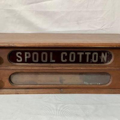 LIBE205 Antique Two Drawer Spool Thread Cabinet	Nice wood 2 drawer cabinet with 'Spool Cotton' etched in a red glass. Both...