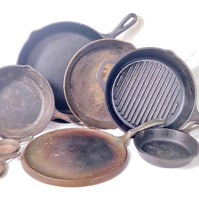 JIFI931 Cast Iron Ware	7 Lodge cast iron skillets
