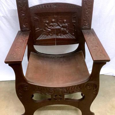LAGO701 Antique Wood Carved Chair	Rathskeller drinking and friends depiction. The seat is curved. Looks to be possibly tiger oak.Â 
