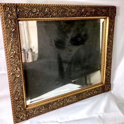 JIFI972 Large Molded Plaster Framed Mirror	Rectangular gilded plaster over wood mirror with beveled edge, reinforced seems on back,...