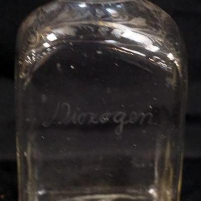 1052	ANTIQUE APOTHACARY DIOXOGEN ETCHED BOTTLE WITH PONTIL MARK ON BASE AND GILT DECORATED, APPROXIMATELY 8 IN
